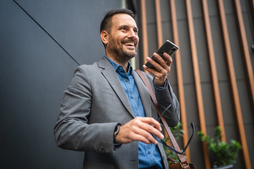 A businessman using an AI search engine showing voice search and AI-powered search with generative engines to demonstrate the need for GEO or generative engine optimization in marketing